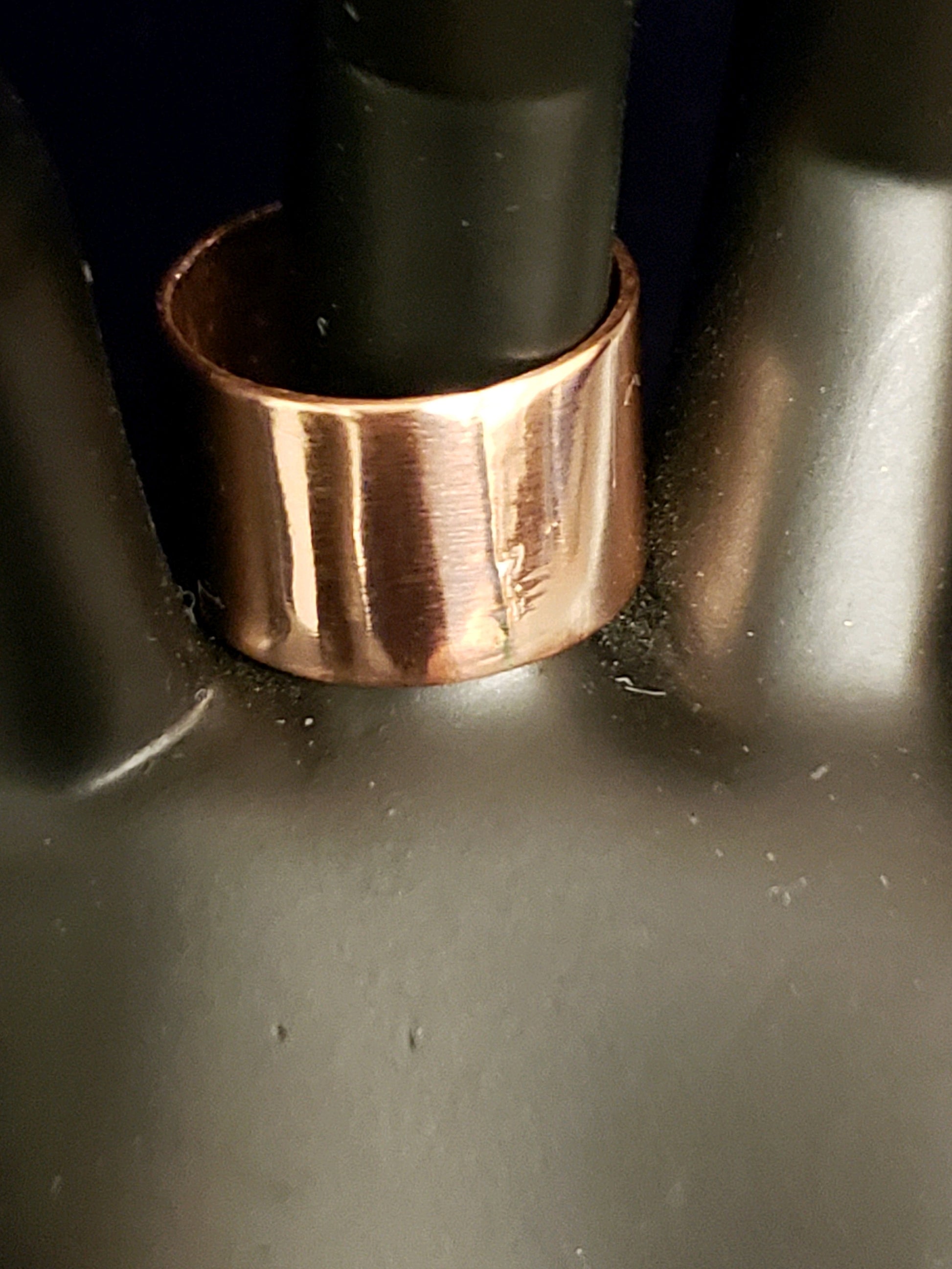 Copper ring on a dark surface